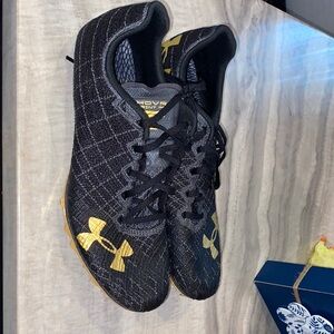 Under Armour Black Sneakers with Gold Highlights